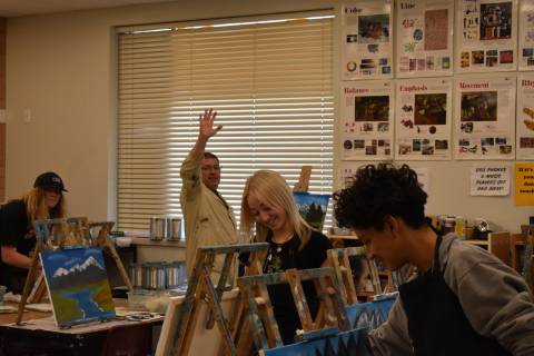 Student's complete their paintings in art class