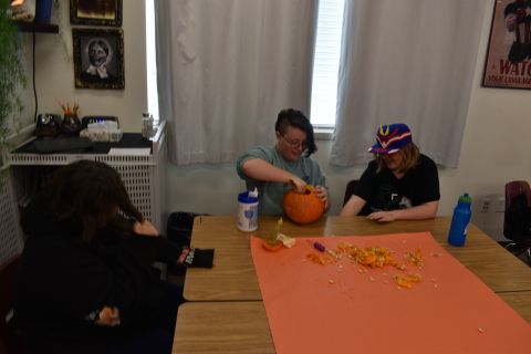 Students carve pumpkins