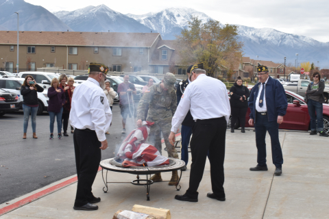 Veterans observe a flag retirement