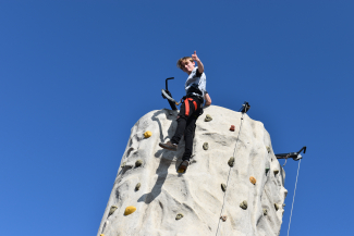 Kyler at the top of the rock wall!
