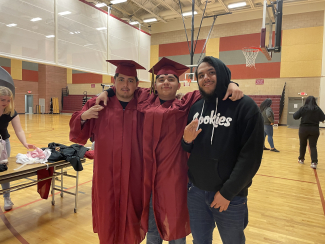 Leo, Raul, and Ethan getting ready to take their cap and gown pictures. 