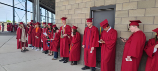 Graduates lining up for graduation. 